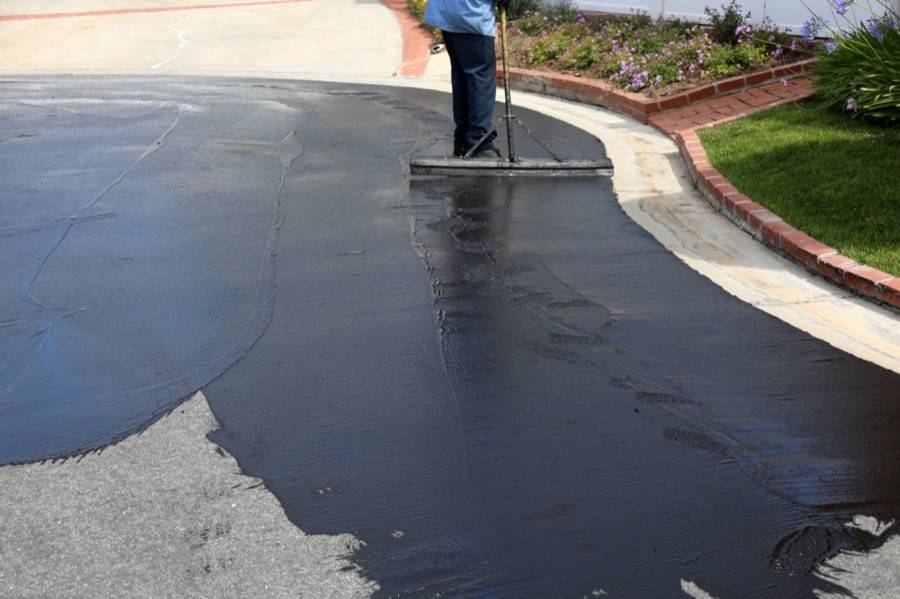 Sealcoating and crack seal application on a driveway